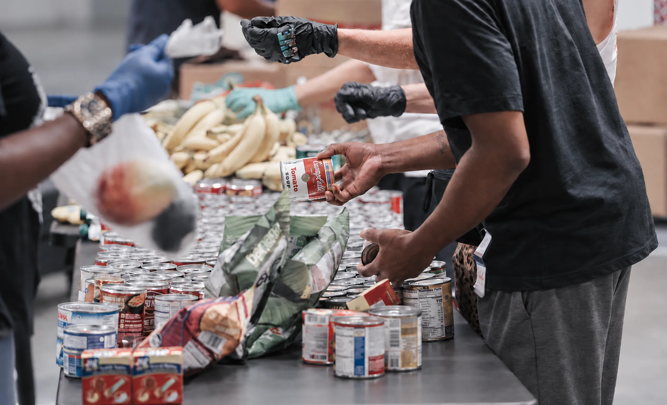 Volunteers sorting canned food donations